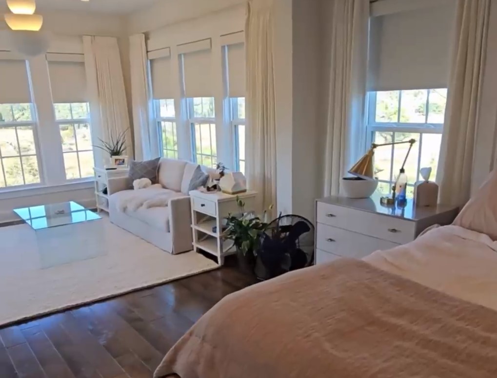 blackout shades rolling up in living room with motorization